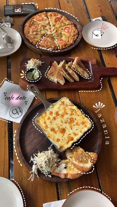 a wooden table topped with different types of food