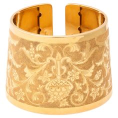 Italian 18 k Engraved Cuff with classical design of flowers and vines. This exceptional cuff can be worn on the wrist or the forearm it is beautifully executed and a one of a kind. It has a two-tone look. Traditional Luxury Cuff Bracelet With Inlay, Elegant Engraved Cuff Bracelet For Formal, Elegant Engraved Cuff Bracelet For Formal Occasions, Classic Formal Cuff Bracelet With Intricate Design, Classic Intricate Cuff Bracelet For Formal Occasions, Elegant Engraved Ceremonial Cuff Bracelet, Elegant Ceremonial Engraved Cuff Bracelet, Elegant Engraved Cuff Bracelet For Ceremonial Occasions, Luxury Engraved Yellow Gold Cuff Bracelet