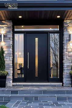 the front entrance to a modern home with two potted plants on either side of the door