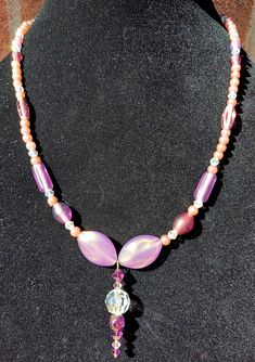 Handmade Purple pearls and glass bead necklace with beautiful pendant.  Pendant features a round clear crystal ball bead.  One of a kind designs.  Light purple hues run through this piece.  Clear crystal beads added to make it sparkle in the sunlight.  Great for everyday wear or to dress up any outfit.  Great gift ideas.  Design by Amy Anne Clear Crystal Necklaces With Round Beads For Gifts, Handmade Crystal Beaded Necklaces, Clear Beaded Necklaces With Round Beads For Gifts, Handmade Round Crystal Beaded Necklaces, Clear Gemstone Beads Necklaces, Clear Round Bead Necklaces For Gifts, Clear Round Bead Necklace For Gift, Clear Round Beads Necklace For Gift, Round Crystal Necklaces With Large Beads For Gifts