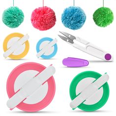 a collection of different colored pom poms hanging from strings with scissors and pliers