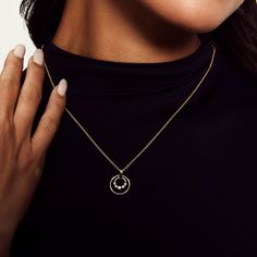 The Cloud Double Ring Pendant Necklace displays the shared prong motif ring and larger solid gold ring. It's the perfect gift for someone special. SKU #P385 15mm x 1mm ring and 9mm x 2mm diamond ring pendant 1.5mm cable chain adjustable from 18”-20” 0.21ctw 14K yellow or white gold Modern 14k Gold Jewelry In Diamond White, White Gold Round Jewelry With Polished Finish, White Gold Jewelry With Polished Finish, Polished White Gold Jewelry, Modern Yellow Gold Jewelry With Brilliant Cut, Modern Round Diamond Jewelry, Modern Tarnish Resistant Diamond Jewelry, Modern Tarnish-resistant Diamond Jewelry, Modern Tarnish-resistant Round Cut Jewelry