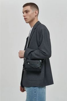 Meet your new go-to accessory: the Crossbody Box Bag with Attached Chain Detail, where style meets practicality.

Crafted with an edgy mix of textures and a thoughtfully designed pattern, this bag is made for those who appreciate a touch of moody sophistication. The exterior boasts a durable, grainy finish complemented by a bold chain detail, offering a juxtaposition of nonchalance and polish. Inside, the bag features a neatly organized compartment with a dedicated space to secure your essential Edgy Rectangular Shoulder Bag With Chain Strap, Modern Crossbody Box Bag With Chain Strap, Modern Box Bag With Chain Strap For Everyday Use, Modern Box Bag With Chain Strap, Modern Leather Box Bag With Chain Strap, Modern Clutch Box Bag With Chain Strap, Rectangular Bag With Double Chain For Everyday Use, Urban Wear, Box Bag