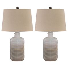 two white lamps sitting next to each other