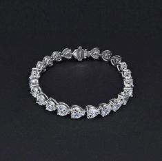 Information Metal: 925 Sterling Silver; Chain Length/Perimeter: 160mm/170mm/180mm; Plating Color: White Gold Gem type: Sona Simulated Diamond Stone Shape: Heart Cut(6*6mm) Number of Stones 24; Stone Color: White Stone Classic Bangles, Simulated Diamond Rings, Gemstone Bangle, 925 Sterling Silver Chain, Wedding Bracelet, Sterling Silver Heart, Diamond Stone, Gold Bangles, Sterling Silver Chain