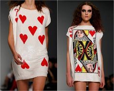 two models in dresses with playing cards on the front and back of their outfits, one is