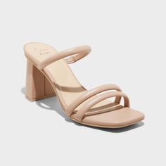 Upgrade your footwear with these Stacy Mule Heels from A New Day™. These slip-on sandals are sure to win you over with their modern open D-toe, 2-strap vamp and slender instep strap. With a breezy backless silhouette and cushioned insole, the medium-width sandals are set on a three-inch flared block heel for a statement lift in your height, whether you choose to dress them up or down. A New Day™: Style that goes wherever you do. Nude Shoes Block Heel, Womens Block Heels, Nude Heel Sandals, Hoco Shoes Short Heels, Nude Bridesmaid Shoes, Pref Dresses, Beach Socks, Homecoming Shoes, Strappy Mules