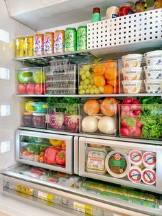 an open refrigerator filled with lots of fresh fruits and vegetables