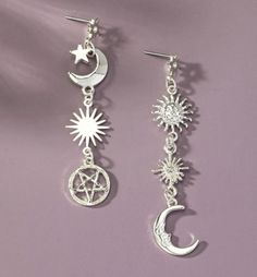 Add a celestial touch to your ensemble with these Mismatched Sun, Moon, and Star Linear Drop Post Earrings. This unique set features a pair of earrings with an enchanting combination of various charms, including the sun, moon, and star, all aligned in a linear design. These mismatched earrings offer a whimsical twist, perfect for those who love to stand out with a touch of cosmic charm. Each charm is delicately adorned with glass rhinestones, adding a subtle sparkle that catches the light from every angle. The 2-inch length creates a graceful drop, making these earrings a stylish choice for both casual and formal occasions. The post-back design ensures a secure and comfortable fit, allowing you to wear them all day or night with ease. Icon Clothing, Icon Shoes, Linear Design, Sun Moon Stars, Iconic Dresses, Cardigan Sweater Coat, Mismatched Earrings, Moon And Star, Cardigan Sweater Dress