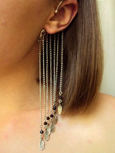 This long chain feather ear cuff with beads and charms I designed for extraordinary person who loves statement jewelry! No piercing needed to wear this ear cuff model. It slips behind your ear and rest against your head with the dangles showing below the ear seven pieces of chain with the feather charms. It's very comfortable and easy to wear. The length of chain with charm is 13 cm (5 in). The price is for 1 ear cuff. More unusual ear cuffs from SomeBijoux4You: https://www.etsy.com/shop/SomeBij Bohemian Pierced Ear Cuff For Party, Bohemian Style Pierced Ear Cuff For Party, Party Dangle Ear Cuff With Adjustable Chain, Bohemian Dangle Ear Cuff For Party, Bohemian Party Dangle Ear Cuff, Spike Ear Cuff, Silver Ear Cuff Earrings, Feather Ear Cuff, Unusual Christmas Gifts