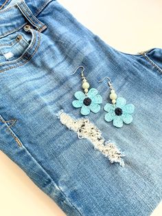 "Fun, summer style, and unique blue flower earrings!  These beaded crochet earrings made with a shiny polyester thread forming a delicate lace flower. Semi precious gemstones are also added. The blue flowers are 1.5\" in diameter and the drop length of these flower dangle earrings is 2.5\". All of BloomingSpringDesign's products are made in a smoke and pet free environment.  They are designed joyfully and delicately produced. My aim is to make you happy with your purchase, so if you are not fully satisfied with them please contact me. Your purchase will arrive gift wrapped. If you would like a handwritten note added as a part of a gift, please let me know.  If these blue flower earrings are not exactly what you are looking for, please check the rest of my handmade earrings designs; https:/ Spring Beach Flower Beaded Earrings, Handmade Flower Drop Earrings For Summer, Light Blue Flower Earrings For Spring, Handmade Flower Earrings For Beach In Summer, Summer Light Blue Pierced Earrings, Flower-shaped Earrings For Beach In Summer, Blue Flower-shaped Summer Earrings, Blue Flower Shaped Earrings For Summer, Blue Flower Earrings For Spring