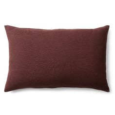 a brown pillow on a white background