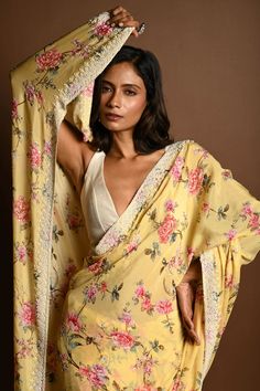 Featuring charming floral prints and a delicate pearl embroidery border, this butter yellow georgette saree is perfect for adding a touch of sophistication to any occasion. Yellow Georgette Saree, Baluchari Saree, Golden Blouse, Silver Blouse, Embroidery Border, Orange Saree, Net Blouses, Pearl Embroidery, Cotton Gowns