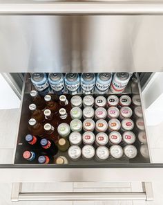 an ice chest filled with beer bottles and cans