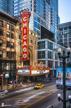 the chicago theater marquee is lit up at night