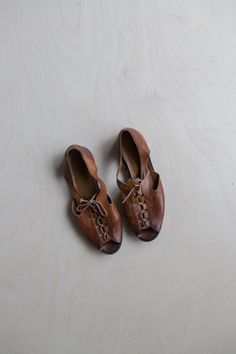 "Measurements: Size 6.5/7 Width: 3.5 (at widest) Length: 9.75\" Heel height: 3/4\"  Lace up Cut out sides Open toe" Spring Lace-up Heels With Leather Sole, Leather Lace-up Sandals With Round Toe, Brown Round Toe Lace-up Shoes For Summer, Spring Brown Leather Lace-up Sandals, Brown Lace-up Sandals With Leather Sole And Round Toe, Summer Leather Lace-up Shoes With Closed Toe, Spring Brown Leather Lace-up Shoes, Brown Flat Heel Lace-up Sandals For Spring, Brown Leather Lace-up Shoes For Spring