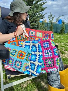 Colorful granny square crochet bag in boho style. It can also be used as a make-up bag or cosmetic bag. 📌100% handmade 📌Lined and zippered 📌I used washable cotton threads 📌You can wash your bag in the delicate section. 📌Bag color may vary slightly depending on different monitor settings. 📌Information About Shipping: Please note that delivery times may vary depending on customs clearance in your country and unforeseen delays. You can also check out my other products in my store👇 https://ae Handmade Rectangular Crochet Bag For Festival, Bohemian Granny Square Crochet Bag For Crafting, Bohemian Crochet Rectangular Bag For Festivals, Bohemian Crochet Rectangular Bag For Gifts, Bohemian Blue Crochet Bag With Granny Square, Bohemian Crochet Rectangular Bag Gift, Bohemian Rectangular Crochet Bag For Gift, Bohemian Crochet Bag With Granny Square, Festival Rectangular Bag With Granny Square Details