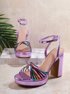 These high heel sandals feature a stylish color block design and criss cross straps, adding a touch of chic to any outfit. Perfect for any occasion, these sandals offer both style and comfort with their sturdy heel and secure straps. Step out in style with Strappy and Chic sandals. Color : Lilac Purple Style : Funky Toe : Open Toe Pattern Type : Plain Details : Buckle, Twist Strap Type : Ankle Strap Heels : Platform, Chunky Heel Height : High Heel Upper Material : PU Leather Lining Material : PU Leather Insole Material : PU Leather Outsole Material : TPR Size Ball Girth Foot Length Heel Height Platform Height US5.5 8.1 8.9 4.1 0.7 US6 8.3 9.1 4.1 0.7 US6.5 8.4 9.2 4.1 0.7 US7 8.5 9.4 4.1 0.7 US7.5 8.6 9.5 4.2 0.7 US8 8.7 9.7 4.2 0.7 US8.5 8.9 9.8 4.2 0.7 US9 9 10 4.2 0.7 US10 9.2 10.3 4.3 Party Heels With Crisscross Strappy Design, Party Heels With Crisscross Straps, Ankle Strap Heels With Crisscross Straps For Parties, High Heel Sandals With Crisscross Straps For Party, Summer Evening Heels With Crisscross Straps, Spring Party Heels With Crisscross Straps, Summer Evening Sandals With Crisscross Straps, Evening Sandals With Crisscross Straps For Summer, Summer Party Sandals With Cross Strap