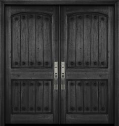 two wooden doors with metal handles on each side