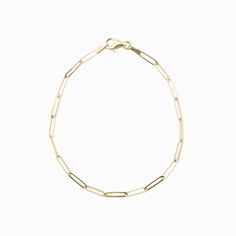 "Simple and delicate bracelet perfect for everyday wear. This bracelet is both dainty and comfortable, making it an ideal addition to any outfit. This paperclip chain bracelet is a stylish and modern piece of jewelry that features a chain made up of interlocking paperclip-shaped links. This type of bracelet is typically crafted from 14 karat gold, which is a high-quality and durable material that is prized for its rich, warm color and lustrous finish. The bracelet is designed to be lightweight and comfortable to wear, making it ideal for everyday use or special occasions. With its sleek and contemporary design, a 14k gold paperclip chain bracelet is a versatile accessory that can be dressed up or down to suit any style. * Made of 14k solid gold * Bracelet length: 7\" * Lobster clasp" Timeless Link Chain Bracelet With Paperclip Chain, Gold Paperclip Link Bracelet, Timeless Chain Bracelet With Rectangular Paperclip Links, Timeless Gold Link Bracelet With Paperclip Chain, Timeless Gold Paperclip Chain Link Bracelet, Timeless Paperclip Chain Bracelet With Rectangular Links, Timeless Yellow Gold Paperclip Bracelet With Gold Chain, Timeless Yellow Gold Paperclip Chain Bracelet, Modern Everyday 14k Gold Filled Bracelet