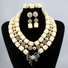 Elevate your Nigerian wedding or party look with this Bead Jewelry. Handcrafted with care, these jewelry pieces add a touch of color and cultural significance to your ensemble, making you stand out with traditional elegance. Traditional Beaded Jewelry For Ceremonies, Elegant Gold Beaded Jewelry For Festivals, Traditional Gold Bridal Necklace With Large Beads, Formal White Jewelry With Polished Beads, Pearl White Jewelry With Gold Round Beads, Colorful Round Beads Jewelry For Traditional Ceremonies, Traditional Large Beads Jewelry For Ceremonies, Traditional Jewelry With Large Beads For Ceremonies, Elegant Handmade Necklaces For Traditional Ceremonies