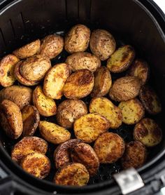 cooked potatoes in an air fryer basket