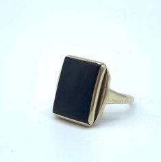 The past will always return in the fashion world and this piece is back for round two! In the 1920's ladies of class wore the most opulent dresses with jewelry to match. As the years continued, jewelry makers tailored pieces to fashion and trends which resulted in affordability for style. Presenting this fantastic Vintage 14k Gold Square Black Onyx Shield Statement Ring Featuring Eclectic Step Inspired Design. Unfortunately this piece is not marked but has been tested and confirmed a minimum of Elegant Gemstone Signet Ring For Formal Occasions, Classic Formal Signet Ring With Gemstone, Classic Formal Gemstone Signet Ring, Elegant Onyx Signet Ring With Gemstone, Elegant Black Signet Ring For Formal Occasions, Classic Polished Evening Jewelry, Antique Jewelry With Polished Finish For Evening, Classic Onyx Jewelry For Wedding, Classic Evening Jewelry With Polished Finish