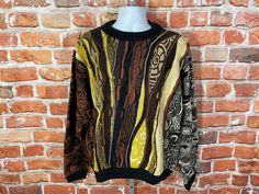 MEASURES -  25.5" pit to pit and 26.5" long TAGGED - L Incredible vintage authentic 90s Coogi sweater. Browns/yellows/cream textured colors and designs. Excellent lightly used condition no major Flaws to note beyond the expected loose thread or two -My policy is NO RETURNS. If I made an error I will make it right 100% but I am not responsible if you change your mind/"item does not fit". PLEASE use the measurements provided if you don't know how ask me I will gladly help you :) - This is a TRUE V 90s Style Fall Sweater For Streetwear, 90s Fall Streetwear Sweater, Vintage Fall Sweater For Streetwear, Vintage Sweater For Fall Streetwear, 90s Fitted Crew Neck Sweater, Fitted Crew Neck Sweater 90s Style, Fitted 90s Crew Neck Sweater, Vintage Fitted Sweater For Streetwear, 90s Brown Long Sleeve Sweater