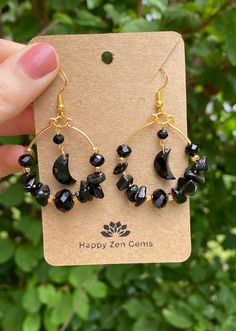 This listing is for a pair of beautifully Witchy, Whimsy Goth Black Onyx Moon Hoop Earrings. Each pair of earrings features genuine Onyx stones as well as black crystals and gold accents for an added sparkle. The wire used in these earrings is gold-colored copper wire.  ･ ｡ﾟ☆: *.☽ .* :☆ﾟ. Onyx is the stone of protection, strength, and willpower. Onyx is an excellent stone in providing one with the ability to pursue their goals and dreams but also protects its wearer along the way. Wearing Onyx provides its wearer with a protective shield, deflecting any negative energy that may come your way.  ･ ｡ﾟ☆: *.☽ .* :☆ﾟ. ☆Care instructions☆ We highly recommend avoiding water and direct sunlight, as prolonged exposure to either can cause the silver and copper to tarnish. ☽Thank you for visiting Happ Small Black Hoop Earrings For Jewelry Making, Black Small Hoop Pierced Jewelry, Black Bohemian Pierced Jewelry, Black Crescent Earrings For Pierced Ears, Black Nickel-free Hoop Earrings As Gift, Nickel-free Black Small Hoop Earrings, Nickel Free Black Hoop Earrings Gift, Adjustable Black Crescent Earrings, Bohemian Nickel-free Black Hoop Earrings