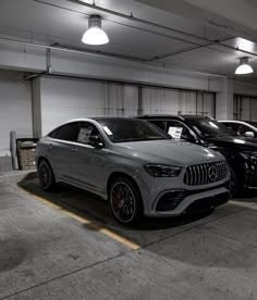 several cars are parked in a parking garage