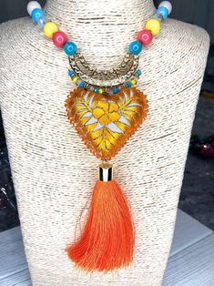 Embroidered Necklace | Etsy Artisan Embroidered Necklaces For Festivals, Traditional Handmade Heart Necklaces, Handmade Orange Beaded Pendant Necklace, Artisan Orange Beaded Necklaces For Festivals, Bohemian Orange Beaded Pendant Necklaces, Handmade Multicolor Beaded Necklace With Heart Pendant, Handmade Multicolor Tassel Necklace As Gift, Handmade Orange Beaded Necklaces For Festivals, Bohemian Embroidered Pendant Necklace