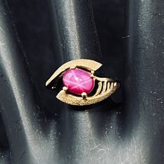 Vintage FC 10k Gold And Oval Synthetic Pink Star Ruby Ring. The ring is stamped FC 10k. I tested the ruby with my Presidium Gem Tester II - It tested in the Ruby/Sapphire range. Size 6 The ruby measures 6.0mm X 7.5mm It comes with a gift box. (Ring #314) USA Seller!! Estate sale find. We do not Clean or Polish our Estate Jewelry we will leave that to you. We also have Jewelry, Hallmark Ornaments, Dept 56, Vintage Glassware and many other items. We will combine shipping for multiple items if possible. Features: * Oval Size: Womens 6 Condition: Pre-Owned Like New Collectible Gold Ruby Ring With Birthstone, Rubin Ring, Star Ruby Ring, Box Ring, Pink Star, Dept 56, Ruby Sapphire, Star Ruby, Hallmark Ornaments