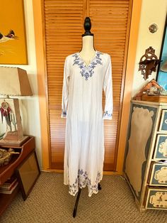 "Thanks for looking!  I love this!! Perfect for the beach or cruise! White cotton Blue embroidery  Great condition  Super light sheer fabric  Measures: 36\" across chest 14\" shoulder to shoulder  Hips 44\" Length 52\"" Embroidered Long Sleeve Cover-up For Vacation, Beach V-neck Dress With Chikankari Embroidery, Vintage Beach Dresses For Beach Season, Beach Maxi Dress With Floral Embroidery, Flowy Vintage Maxi Dress For Beach, Vintage Tunic Dress For Vacation, Vintage Long Beach Dresses, Long Vintage Beach Dress, White Vintage Dress For Vacation