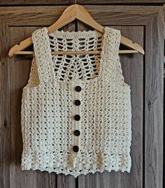 This super cute vest looks great over tops or dresses. It also looks great by itself. This vest is MADE TO ORDER and can be made in sizes xs, s, m, l, xl.  Message me for custom colors.  This vest has free shipping. Cute Sleeveless Crochet Cotton Top, Sleeveless Cotton Crochet Top For Fall, Casual Crochet Sleeveless Vest, Cute Cotton Sleeveless Sweater Vest, Casual Sleeveless Crochet Vest, Sleeveless Crochet Lace Top For Fall, Fitted Sleeveless Crochet Top For Fall, Cute Sleeveless Buttoned Tops, Cute Sleeveless Sweater Vest For Fall