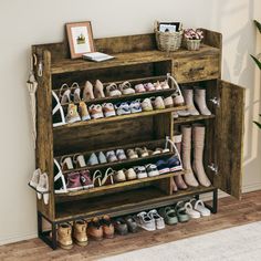 a wooden shoe rack filled with lots of shoes