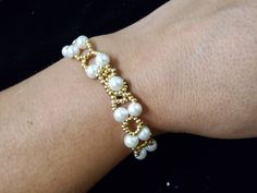 An elastic white beads bracelete White Bangle Stretch Bracelet For Wedding, Elegant White Pearl Bracelet With Spacer Beads, White Pearl Stretch Bracelet With Spacer Beads, Elegant White Beaded Stretch Bracelet, Handmade Elegant Pearl Stretch Bracelet, Elegant Handmade Pearl Stretch Bracelet, White Pearl Stretch Bracelet For Party, Elastic Bracelet, White Beads