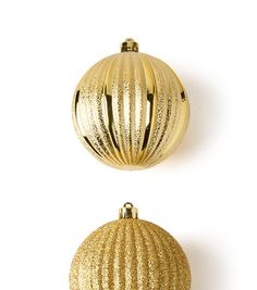 two shiny gold ornaments on a white background, one is round and the other is round