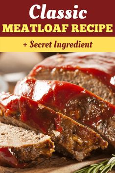 sliced meatloaf on a cutting board with ketchup and rosemary garnish