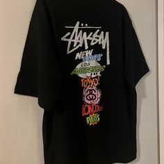 Questions? Leave A Comment Below! Stussy New York London Paris Tokyo Los Angeles T-Shirt 2xl White Black And Multicolor Brand New No Tags 24” Armpit To Armpit 29” Length Skate Boy, Tshirt Oversized, Nyc Subway, York London, White Color, Black Blue, Air Jordan, Graphic Tee, White Black