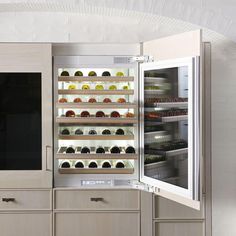 an open refrigerator with many different foods in it's door and shelves on both sides