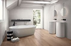 a large white bath tub sitting in a bathroom