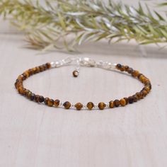 Tigers Eye Dainty Gemstone Bracelet, Tiny Brown & Yellow Gemstone Beads, Skinny Stacking Bracelet, Gold Fill or 925 Sterling Silver This bracelet is very dainty - beads measure about 2.5 mm apiece AAA Quality Please Feel Free To Contact If You Have Any Query. Orders are shipped within 1 business working day, excluding orders made on Sunday or national holidays. Domestic delivery takes 5-7 business days. International delivery takes 11-23 business days. PAYMENT METHOD : PayPal only Please send al Yellow Gemstones, Tigers Eye, Bracelet Gold, Bracelet Stack, Gemstone Bracelet, Tiger Eye, Tigers, Handcrafted Jewelry, Gemstone Beads