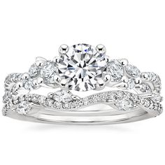 a white gold engagement ring set with diamond accents