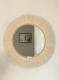 a mirror that is hanging on the wall