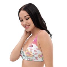 Summer adventures with a little extra lift! This vanilla flower recycled padded bikini top is extremely comfortable and includes pads you can remove. To make this top even more versatile, mix and match it with different layers, including it's coordinating UPF Long Sleeve. Padded cups without wires for ultimate comfort Supportive design for active beach days or poolside relaxation Made from sustainable recycled materials Mix and match with other pieces in the collection Provides freedom of moveme White Yoga Bra For Summer, Spring Sports Bra With Removable Pads, Padded Triangle Top Sports Bra, Summer Padded Sports Bra, Spring Triangle Top Sports Bra With Built-in Bra, Triangle Top Sports Bra With Removable Pads, Triangle Top Sports Bra For Yoga In Summer, Yoga Bra With Removable Pads And Triangle Top, Spring Yoga Sports Bra With Removable Pads