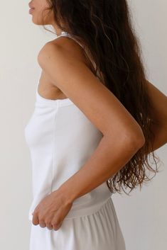 The Baby Rib Scallop Tank is crafted with our softest fabric yet, featuring a slightly cropped fit and scalloped edges on the neckline & straps. Set it up with — The Baby Rib Scallop Pant Made in LA Bra Friendly Crop Top Tank For Loungewear, Basic Fitted Camisole For Loungewear, Cropped Tops With Built-in Bra For Loungewear, Fitted Sleeveless Tops For Relaxation, Spring Tops For Relaxation, Bra Friendly, Spring Relaxation Tops Bra Friendly, Fitted Camisole For Relaxation, Cropped Tank Top With Built-in Bra For Loungewear, Casual Sleep Tops With Built-in Bra