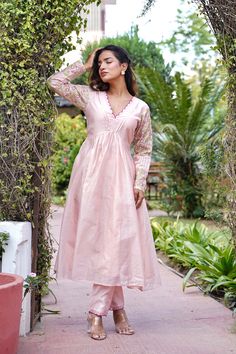 Let your ethnicity take the stage with this Peach Embroidered Chanderi Kurta with Pants Set. This two-piece set includes a kurta with pants. The Peach chanderi kurta has embroidery, a round neckline, full sleeves and scallop detailing. The Peach chanderi pants have embroidery and both of them have an attached lining. COLOUR: Peach MATERIALS: Chanderi CARE: Dry Clean Only Size Chart THESE ARE GARMENT MEASUREMENTS (IN INCHES)                      XS   S   M   L   XL   XXL Chest.         34   36  38  40  42   44 Waist.          30   33  35  37  39   41 Hip.              36  38 40  42 44   46 Shoulder.   13.5 14 14.5 15 15.5 15.5 Kurta Length484848484848 Pants Length393939393939 We accept PayPal for payment, a safest way for both of us.  Thank you! Pink Resham Embroidery Cotton Silk Kurta, Pink Embroidered Cotton Silk Churidar, Spring Pink Chanderi Kurta, Spring Anarkali Set With Zari Work In Cotton Silk, Pink Chanderi Long Sleeve Kurta, Anarkali Cotton Silk Kurta For Spring, Spring Anarkali Cotton Silk Kurta, Designer Pink Kurta For Spring, Spring Anarkali Set With Gota Work And Straight Kurta