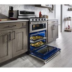 an oven with the door open in a kitchen