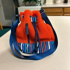 Like Brand New Multicolor Nylon Bags For Spring, Blue Summer Bags With Zipper Closure, Summer Blue Bags With Zipper Closure, Blue Shoulder Bag For School In Spring, Casual Orange Nylon Bag, Spring Blue Bucket Bag With Adjustable Strap, Blue Bucket Bag For Daily Use In Spring, Casual Blue Crossbody Bucket Bag, Blue Nylon Bags For Spring