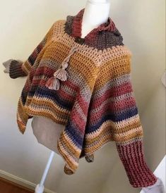 a crocheted sweater on a mannequin head